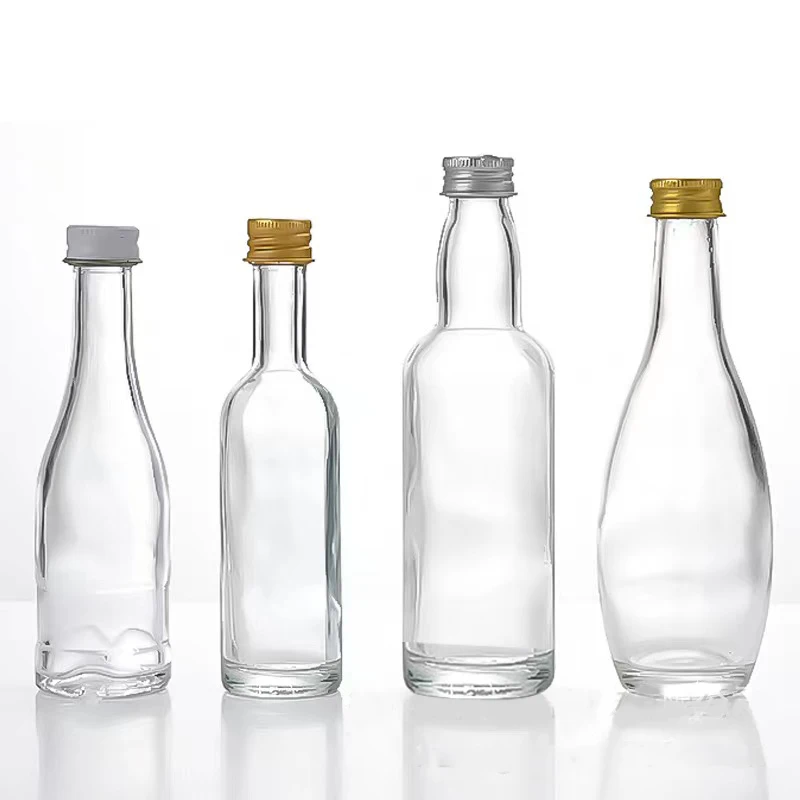 Customized Glass Mini Liquor Bottles 50ml 100ml Clear Whisky Vodka Brandy Wine Glass Bottle with Screw Cap Factory Direct Sale