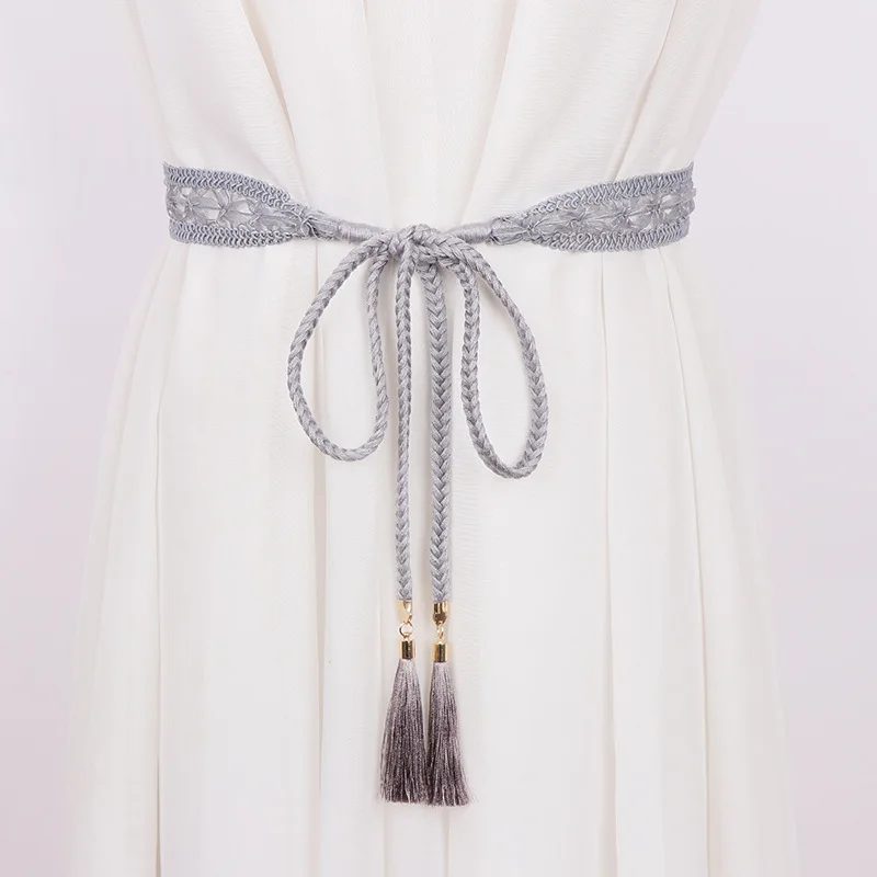 Женский плетеный пояс с бахромой