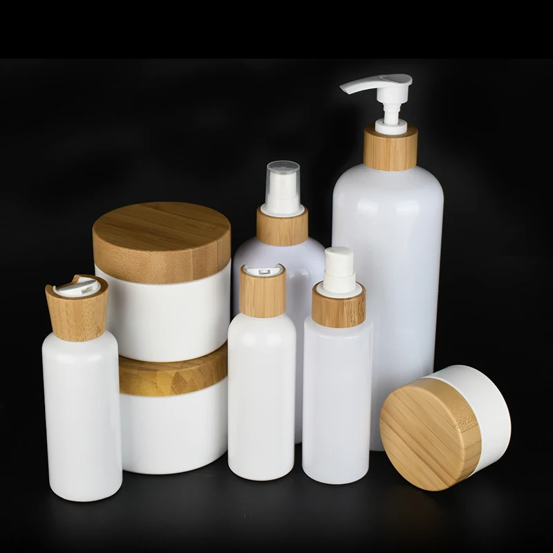 Bamboo series packaging white plastic pump bottles and white plastic cosmetic cream jars with Bamboo lids container