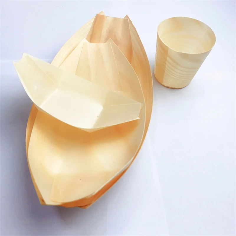Eco-friendly wooden boat plates, biodegradable, suitable for holding various delicacies and displaying at parties.