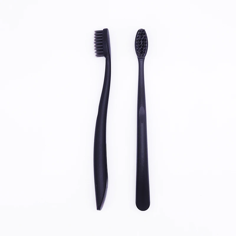 Wholesale custom logo black charcoal bristles pla / corn starch toothbrush with biodegradable eco friendly