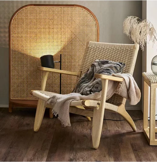 Designers all over the world pursue Nordic rattan saddle chair solid wood back lounge chair