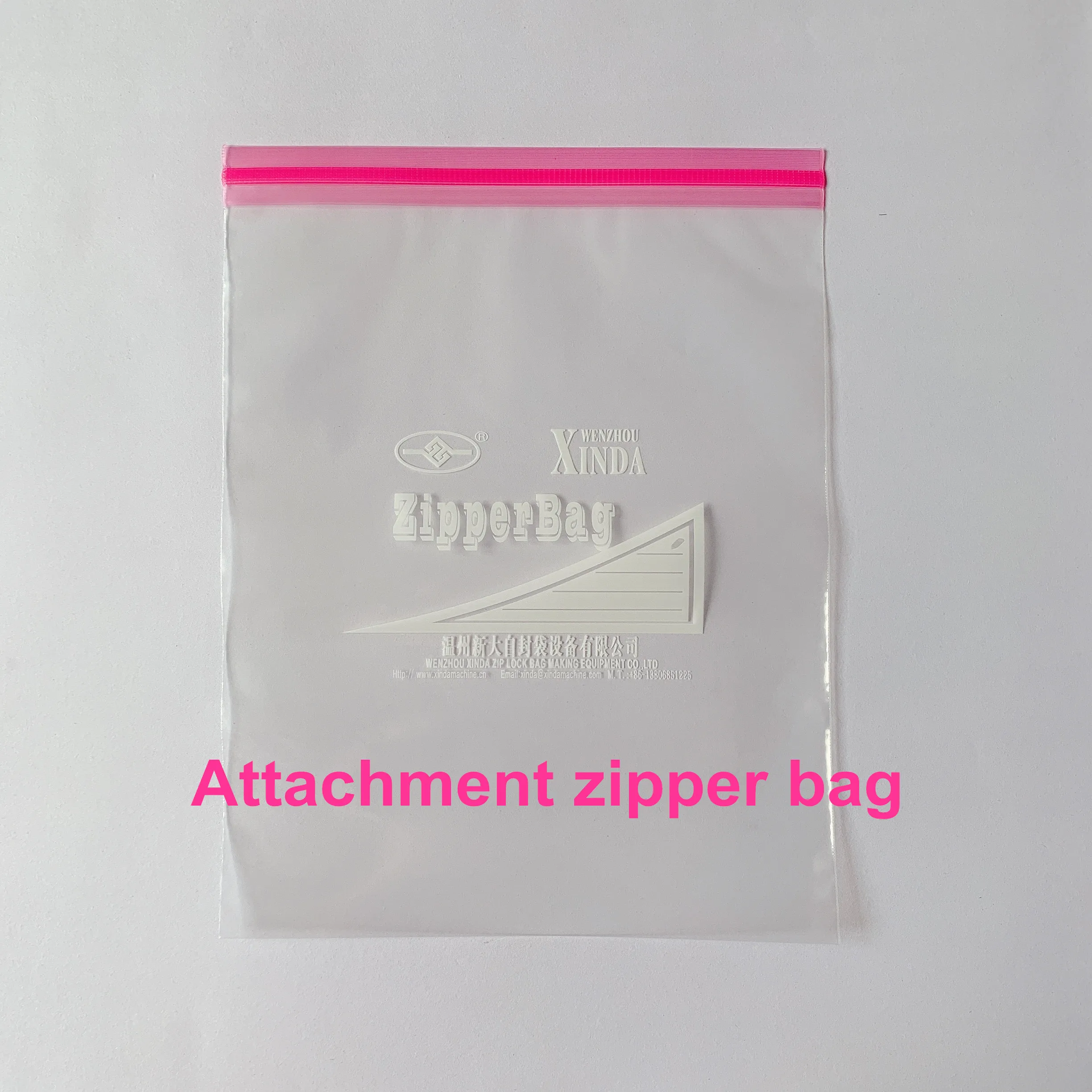 Zipper bag making machine with zipper attachment & auto hanger device cut on the rubber roller