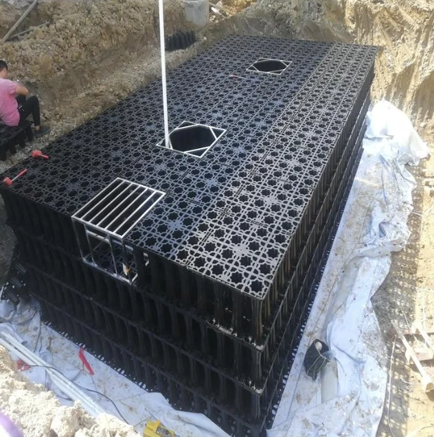 Landscaping garden rainfall collection geocellular modular detention attenuation tank under vehicle driveway and car parking lot