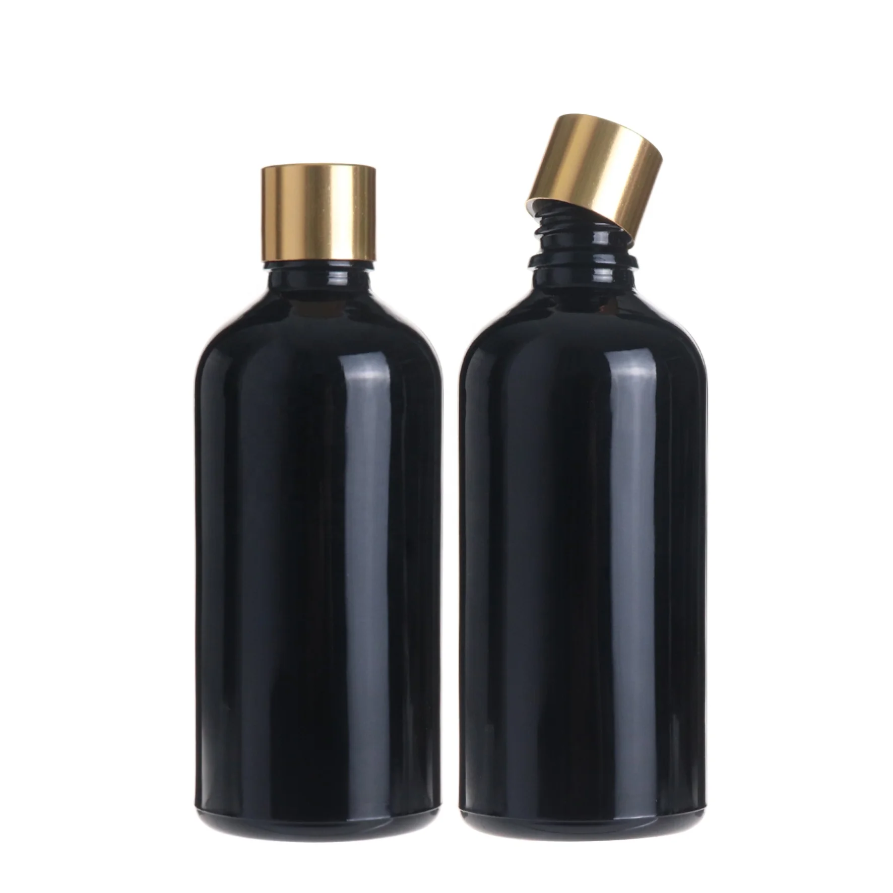 Empty round massage essential oil cosmetic black glass bottle 100ml with golden screw cap