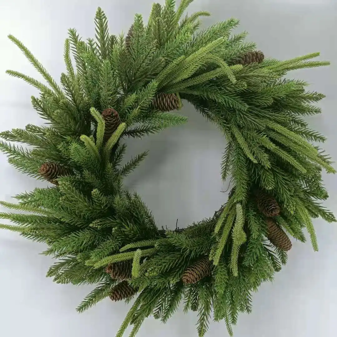 Artificial pine needles and pinecone wreath for Christmas