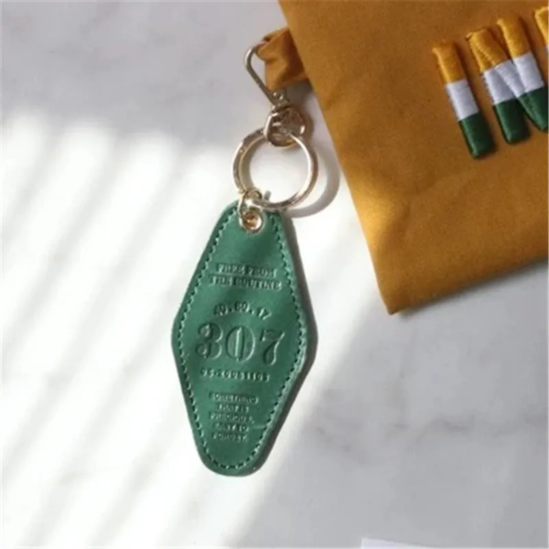 Wholesale Custom Embossed Logo Pure Color Hotel Keychain Blank PU Leather Hotel Room Keychain With Metal Hook Key Tags