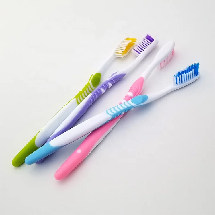 Hard rubber grip adults toothbrush with medium or soft, hard nylon bristle