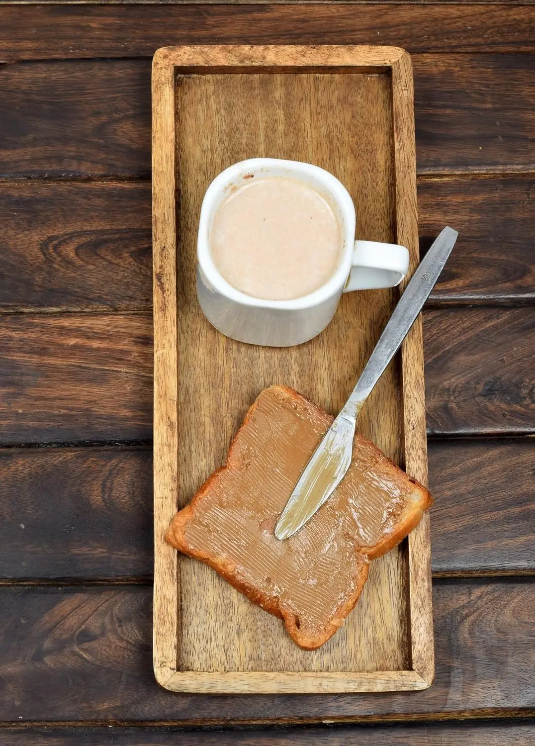 Wooden tray used for displaying fruit snacks, appetizers, sushi, and food decorations