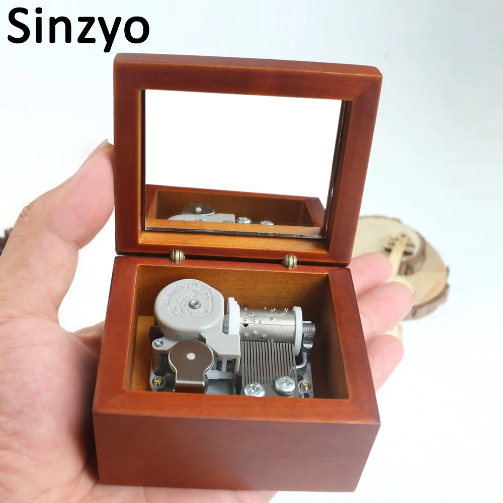 Sinzyo Professional Wholesale Red With Mirror Wooden Music Box Custom Carved Movie Game Pop Melody Music Creative Marketing Gift