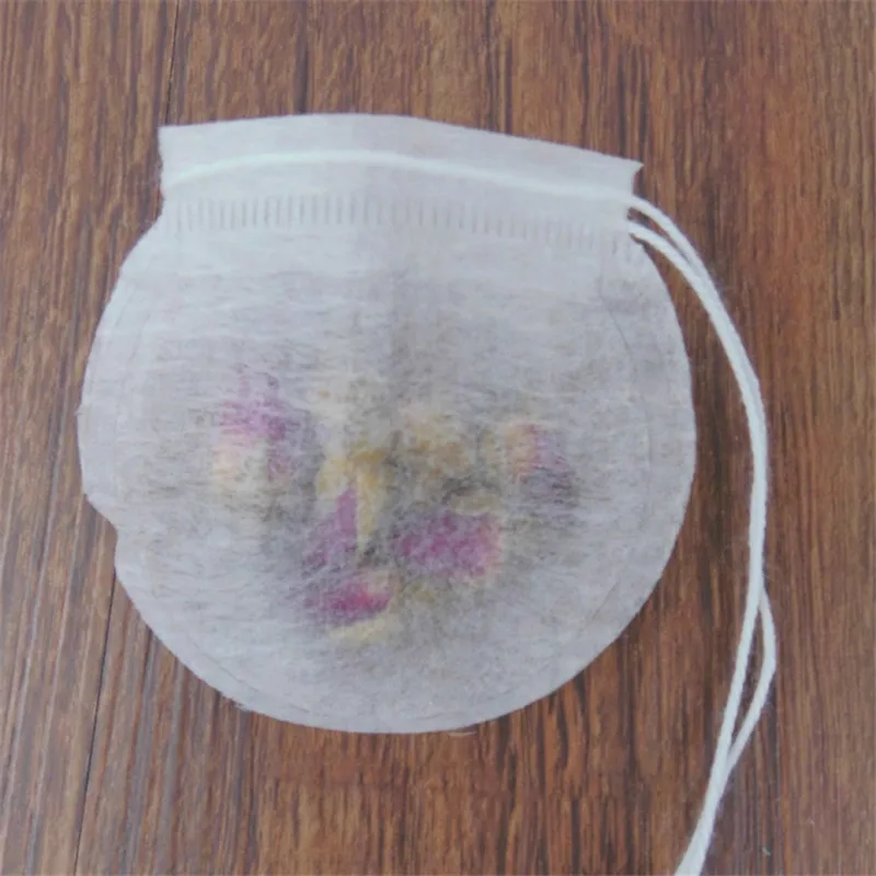 Food grade disposable empty round shape filter paper jasmine shape herbal coffee packaging corn fiber pla tea bag pouch filling
