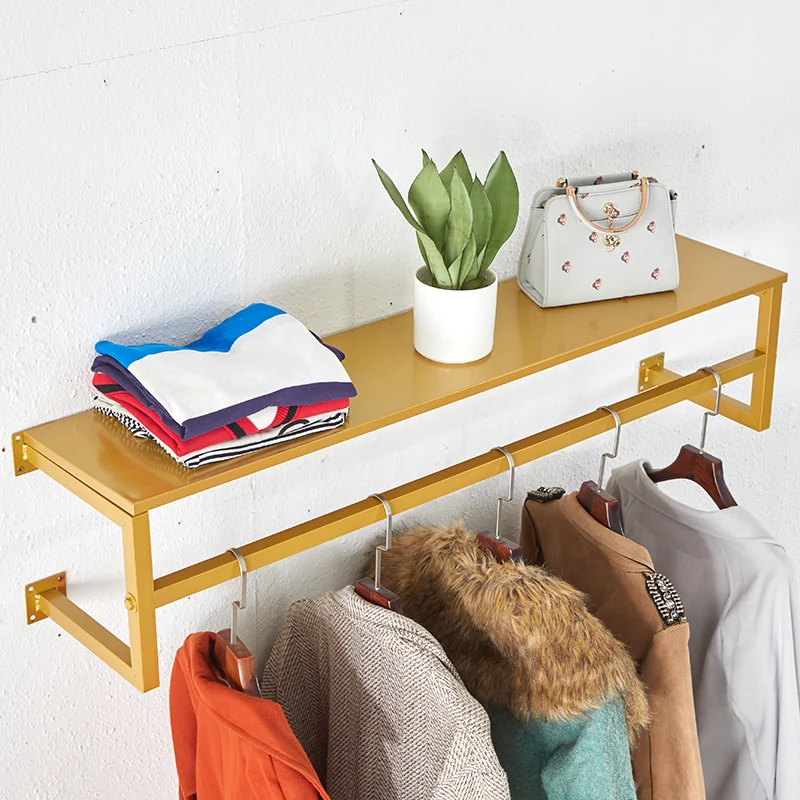 clothes shop display rack wall-mounted clothing rack decorative metal garment rack with storage shelf