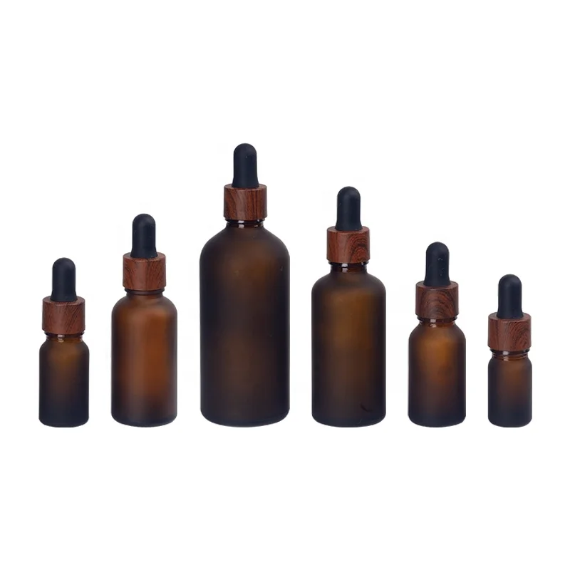 essential oil bottle 5ml 10ml 15ml frosted brown glass bottle 30ml 50ml 100ml frosted amber glass bottle plastic wooden dropper