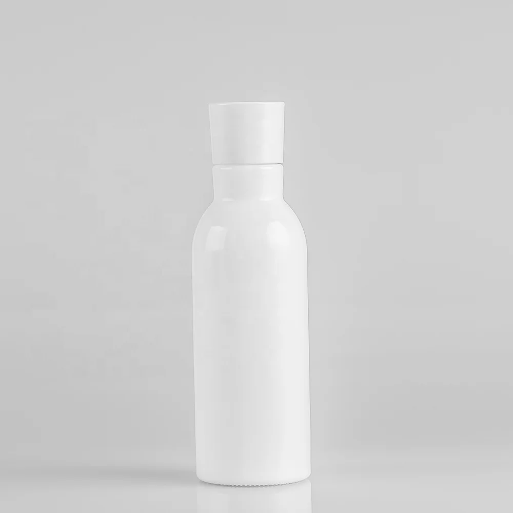 Blue glass bottle with pump and silver cap for lotion and serum