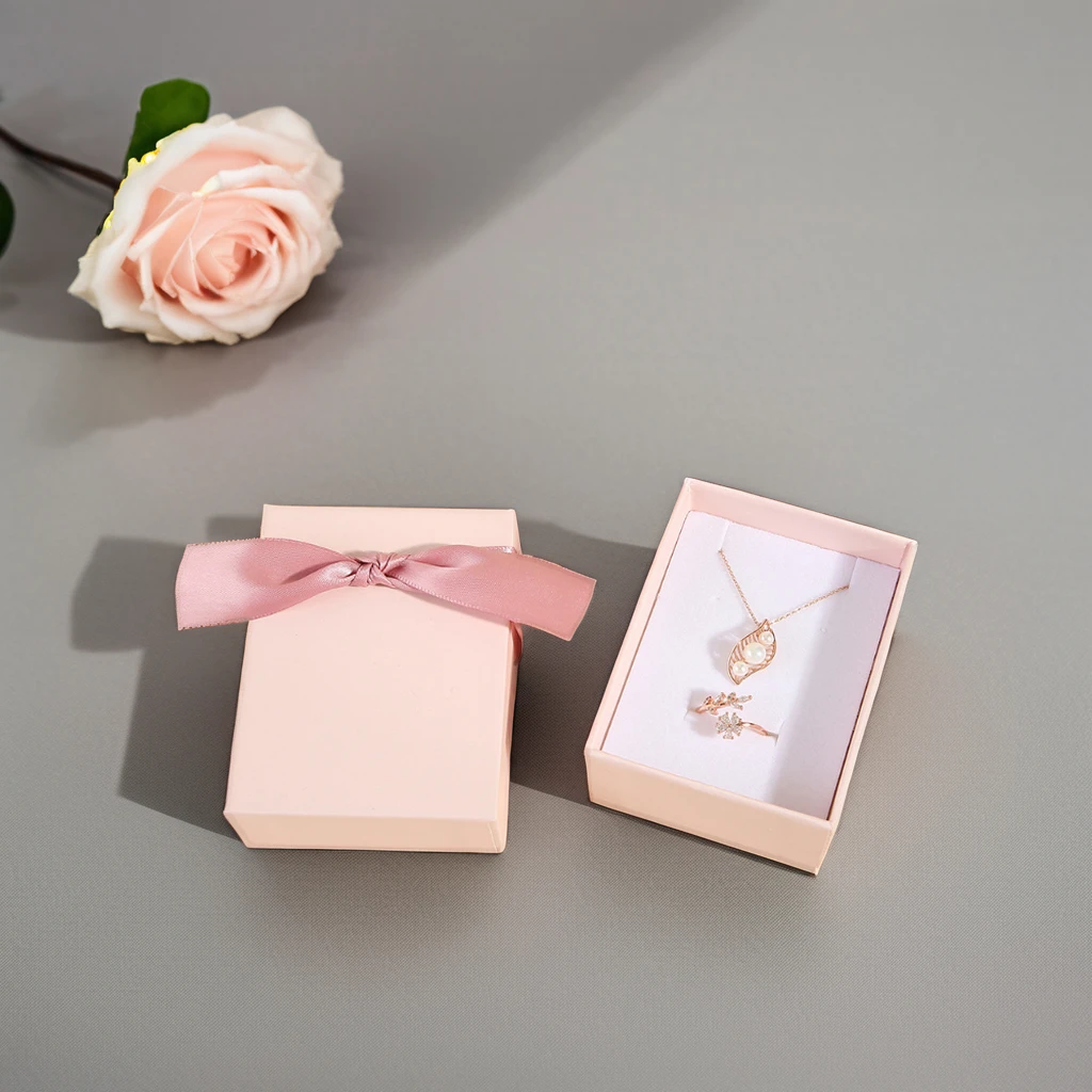 Customizable Pink Paper Jewelry Packaging Box with Ribbon and Handle Sliding Earring Drawer and Custom Logo for Clothing Use