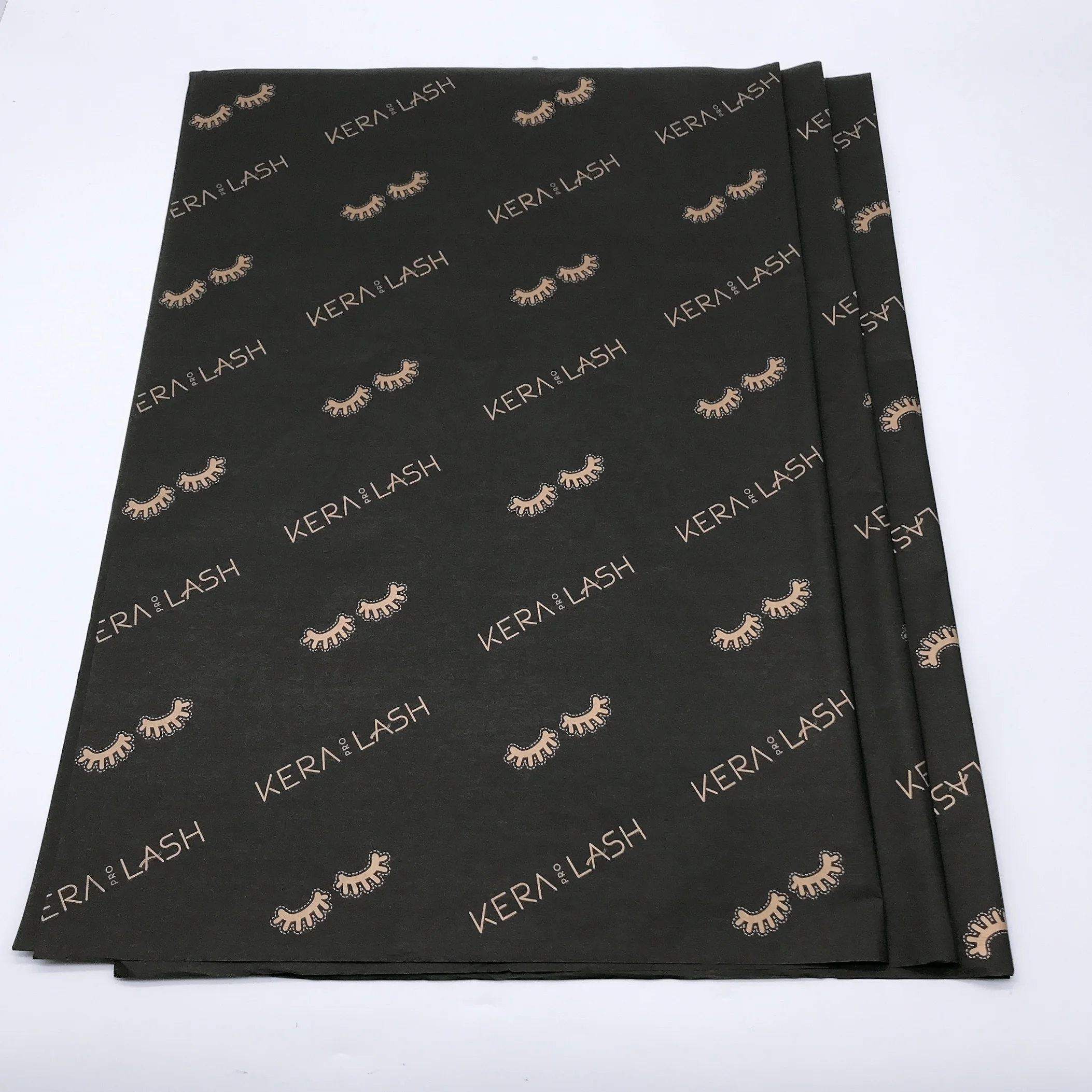 
17g black wrapping tissue paper with gold logo print 