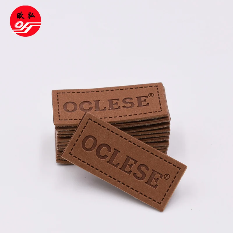 
Good Style Customized Debossed Brand Name Brown PU Leather Badge Patch for Clothing 