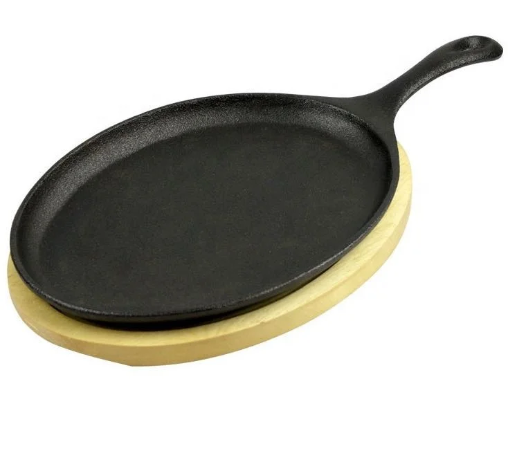 Pre-seasoned cast iron oval sizzler pan with wooden base tary
