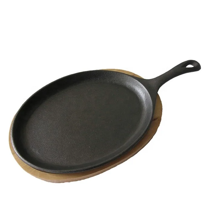 Cast iron oval sizzler pan/fajita pan with wooden base tary