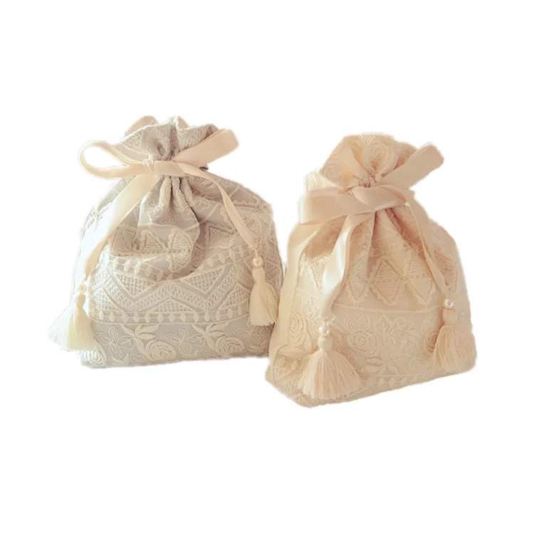 Wholesale China suppliers custom design satin lace bag packaging silk luxury packing bag with tassels and zipper for makeup