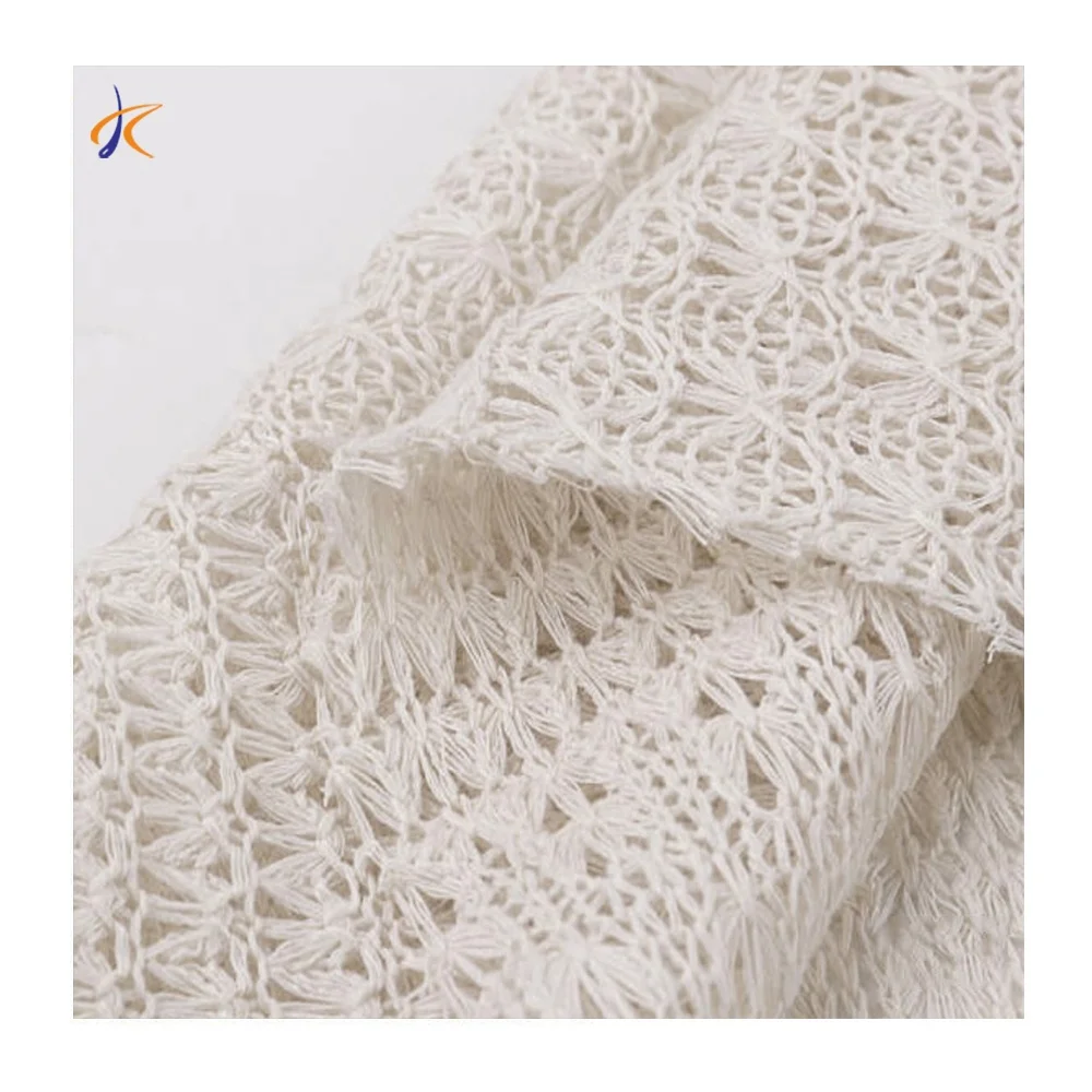 Wholesale 100% polyester hollow out fancy knitted fabric pure white floral pattern clothing fabric