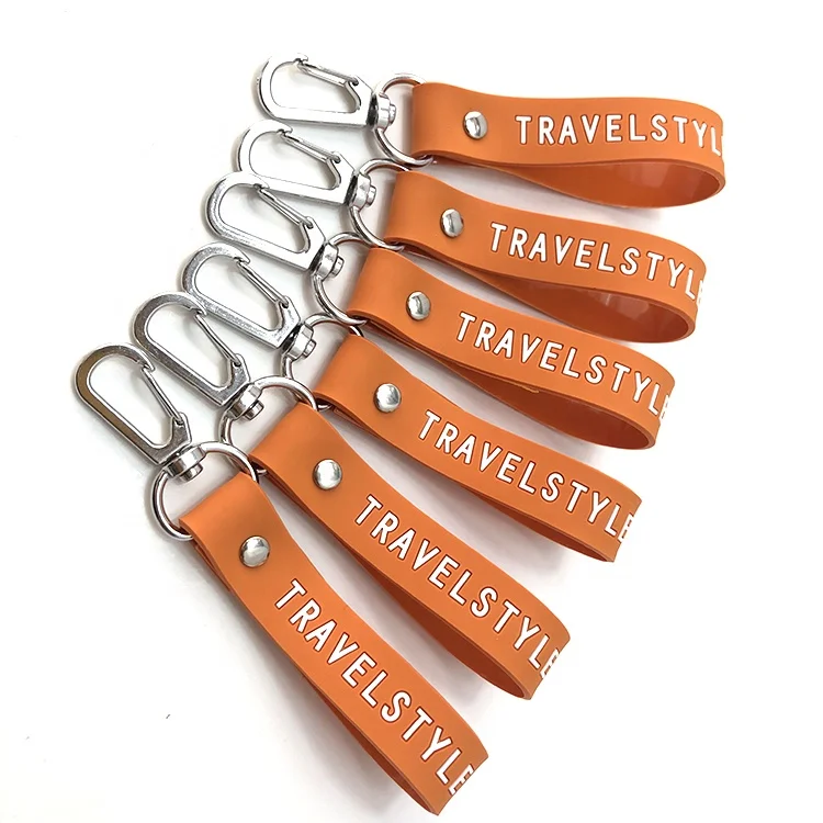 Hot sale black color tape and engraved logo 100% soft silicone wristband key chain
