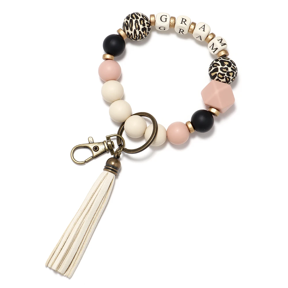2022 Classic Popular Leather Tassel Wooden Bead Keychain Wholesale Bracelet Key Ring Silicone Bead Bracelet