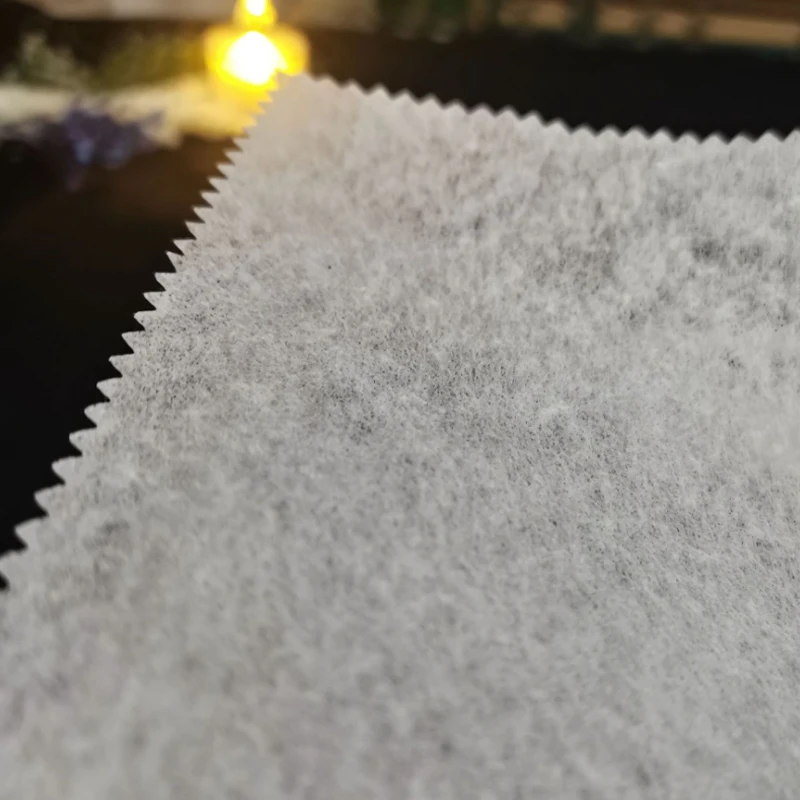 tear away embroidery backing paper 100% polyester nonwoven lining fabric roll for tailoring material 1065HF Eco-friendly