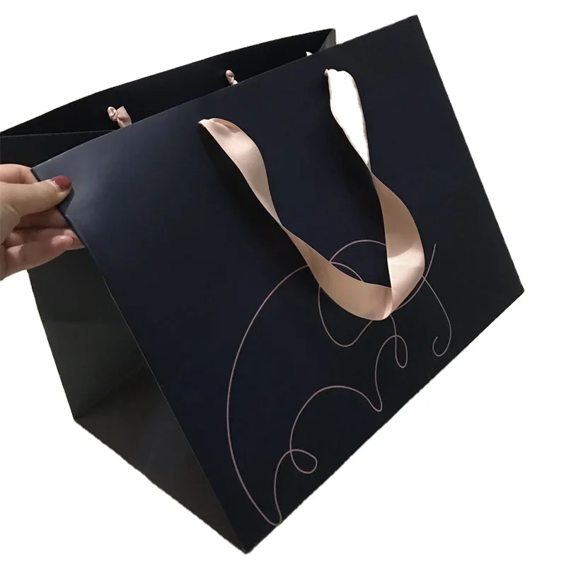 
China factory customize Christmas hot sell high quality recyclable garment paper bags with brand logo print for shopping 