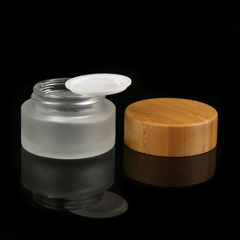 Natural Factory Direct Custom 100g empty round cream glass jar clear frosted bamboo glass cosmetic jars with bamboo lids