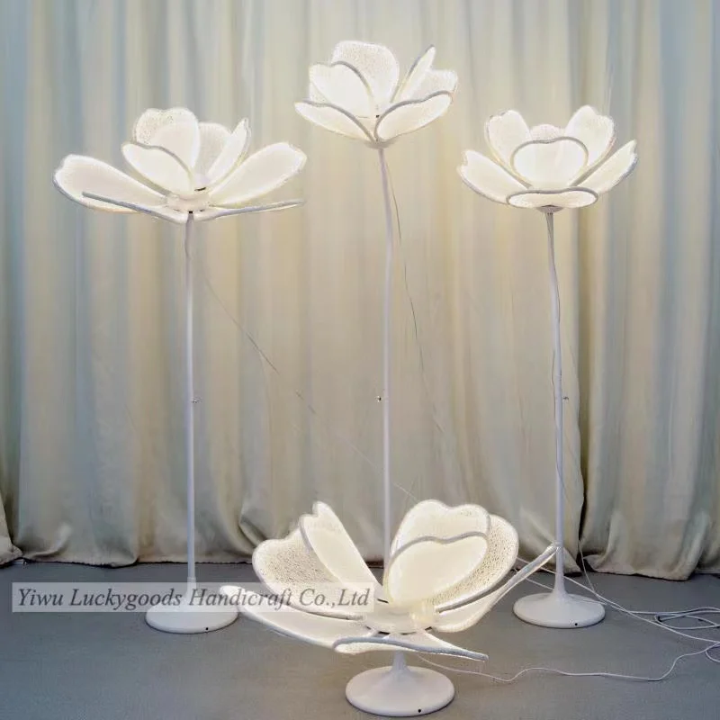 The wedding party is decorated with large flowers and lanterns