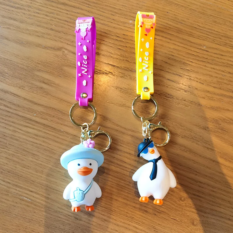 Wholesale cartoon cute funny duck soft rubber pvc keychain girl schoolbag pendant crystal key chains