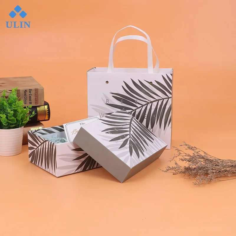 
Creative gifts high-end gift box with hand gift packaging carton custom printed portable box takeout carton 