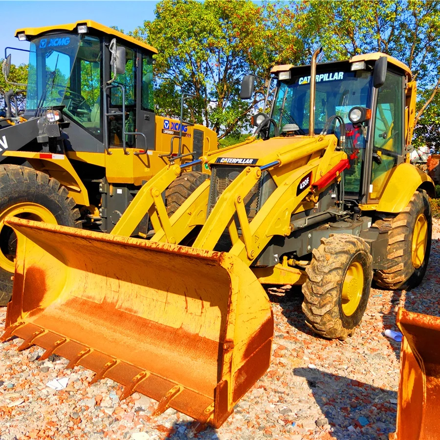 Used Backhoe Loader Cat 420F Tractor with Frontal Loader Bucket and Digging bucket on the Rear Caterpillar Construction backhoe