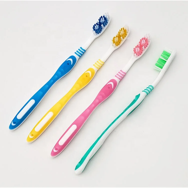 Hard rubber grip adults toothbrush with medium or soft, hard nylon bristle