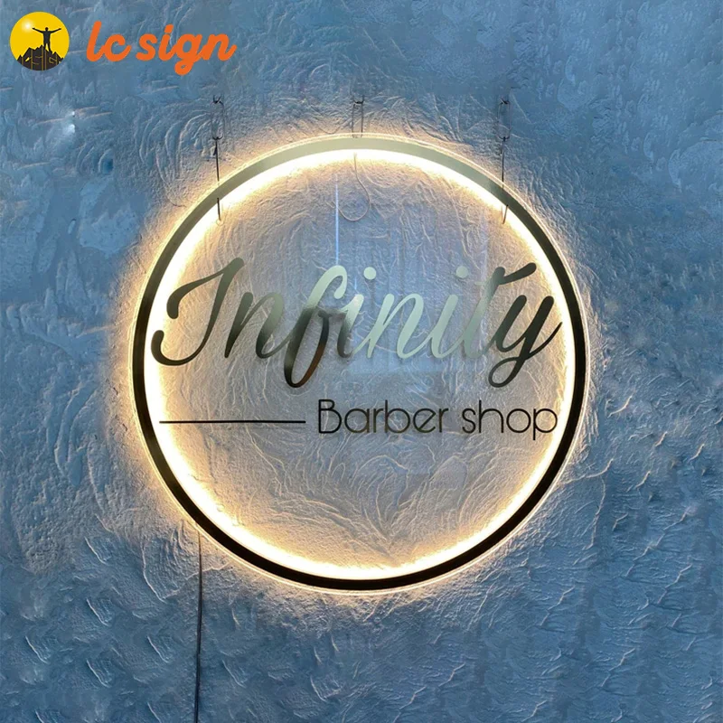 Acrylic white logo with LED light. Golden mirror letters, business signs for beauty salon, boutique, barber shop