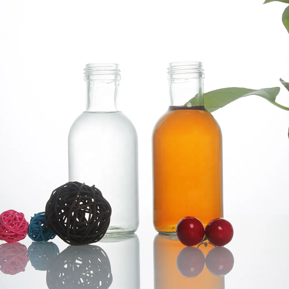 Stocked round clear empty 350ml glass bottle for beverage drinks 120oz fruit juice glass bottle