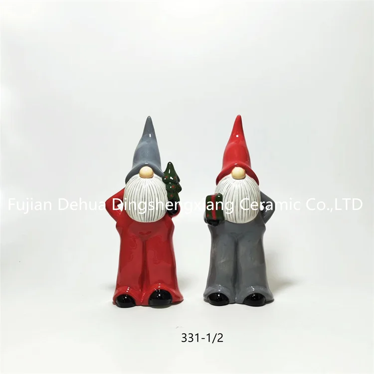Hand-painted ceramic gnome santa claus with present for holiday decoration