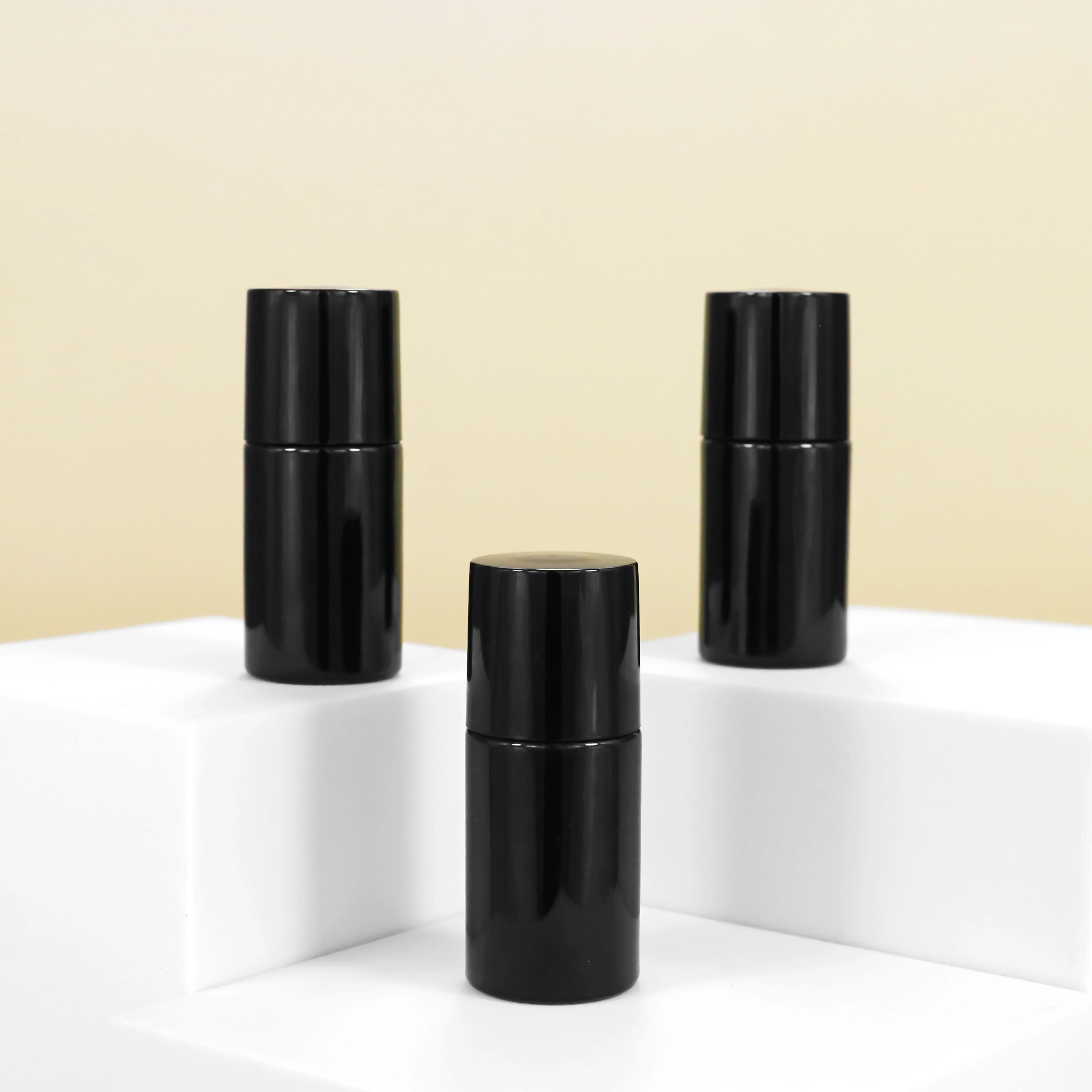 Fancy wholesale small custom cosmetic packaging and printing 7ml black empty luxury cylinder nail polish glass bottles