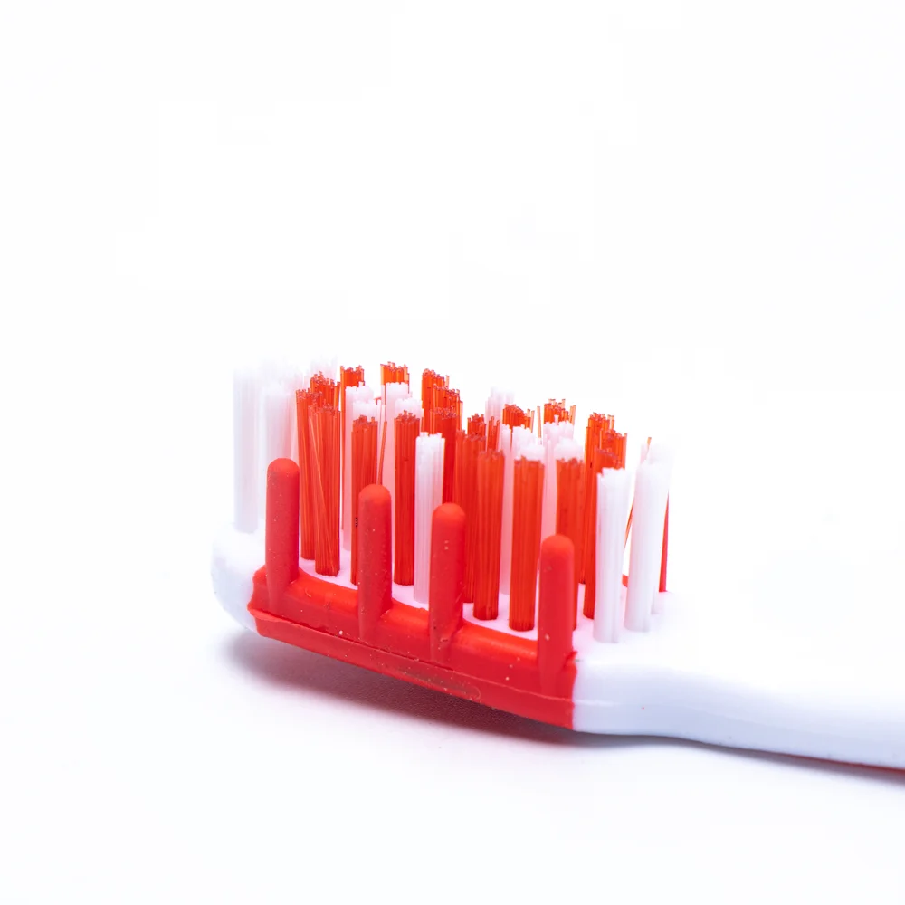 Made in China adult toothbrush with pp colorful handle gum massage feature silicone adult toothbrush