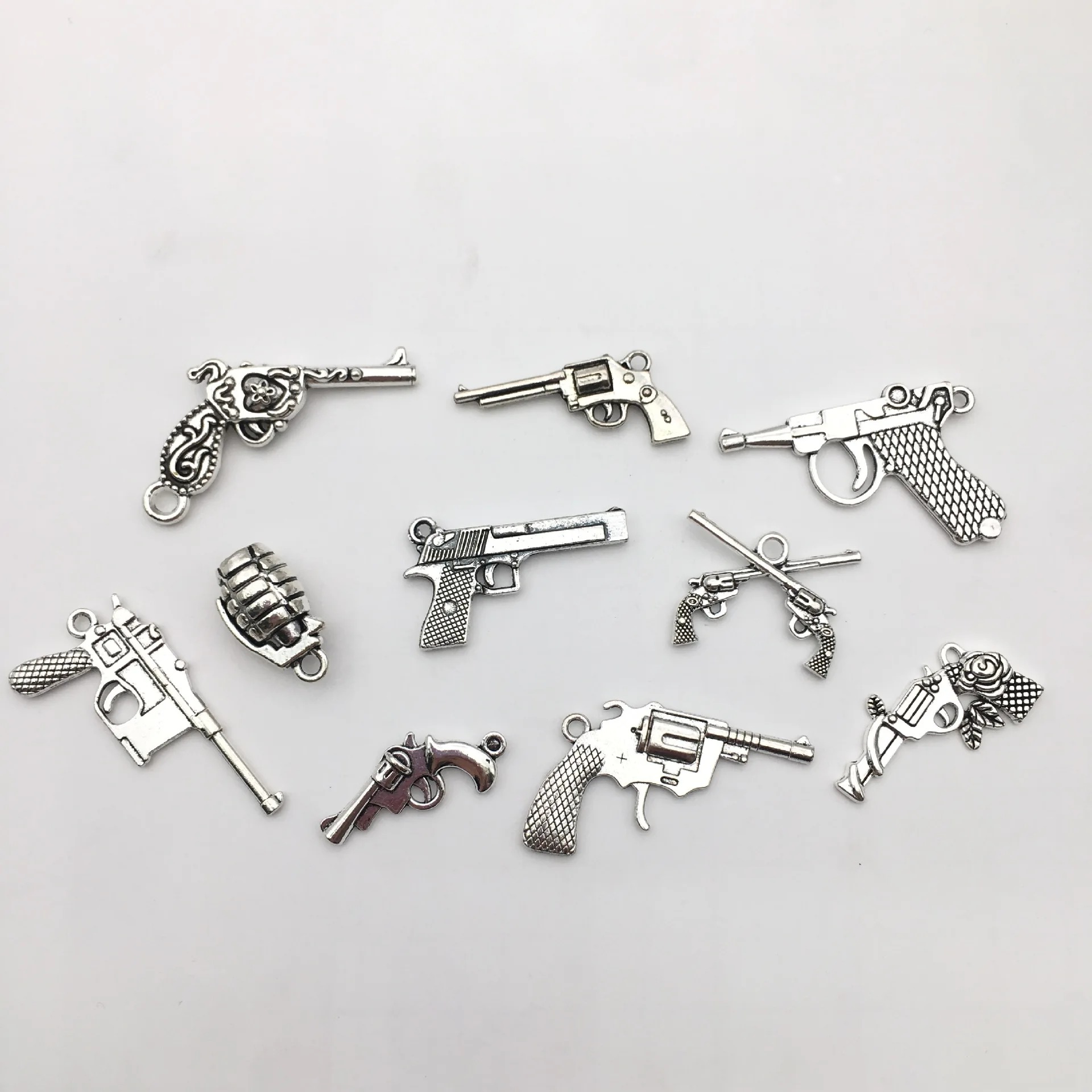 Manufacturers Wholesale DIY vintage alloy jewelry accessories silver guns weapons bullets necklaces bracelets pendants
