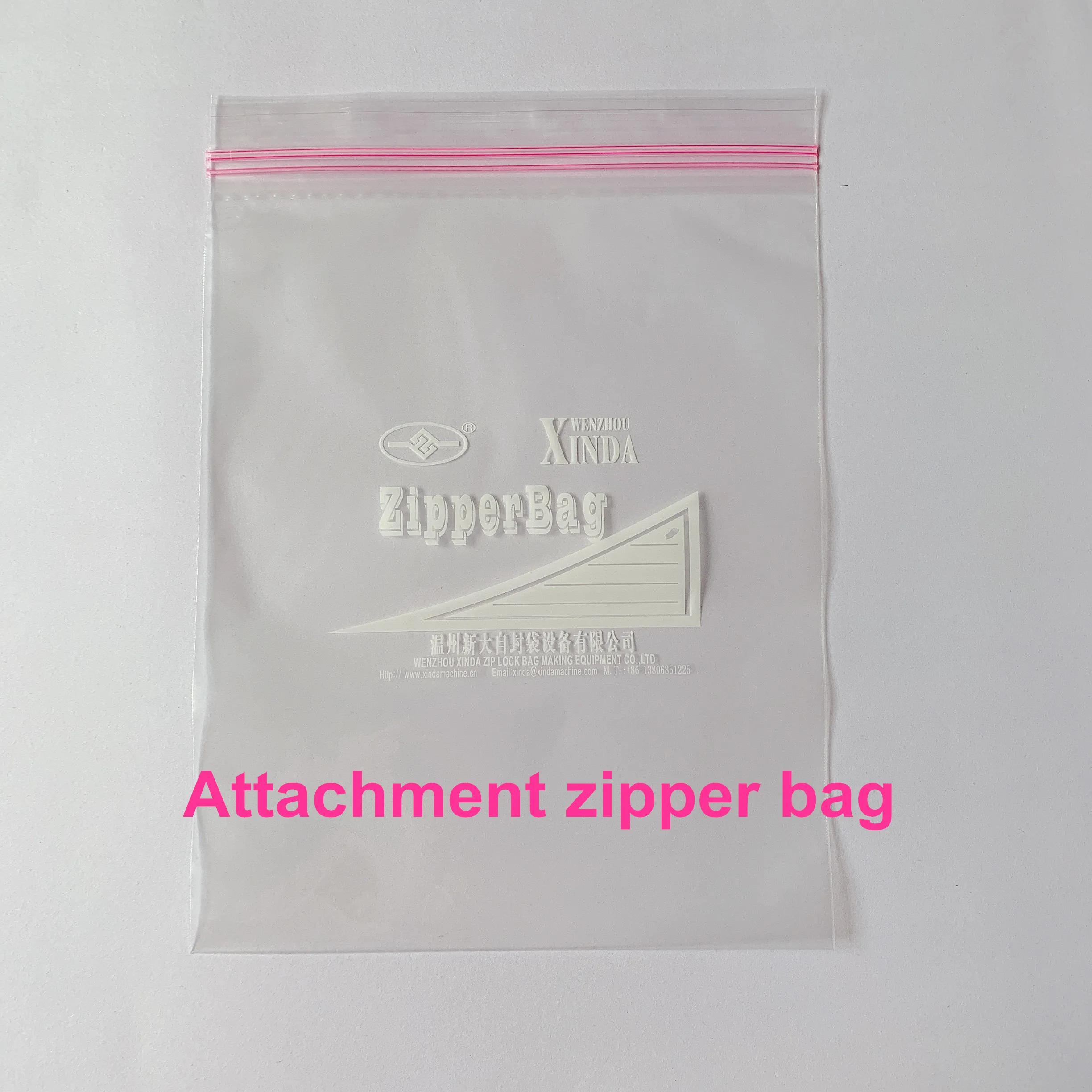 Zipper bag making machine with zipper attachment & auto hanger device cut on the rubber roller