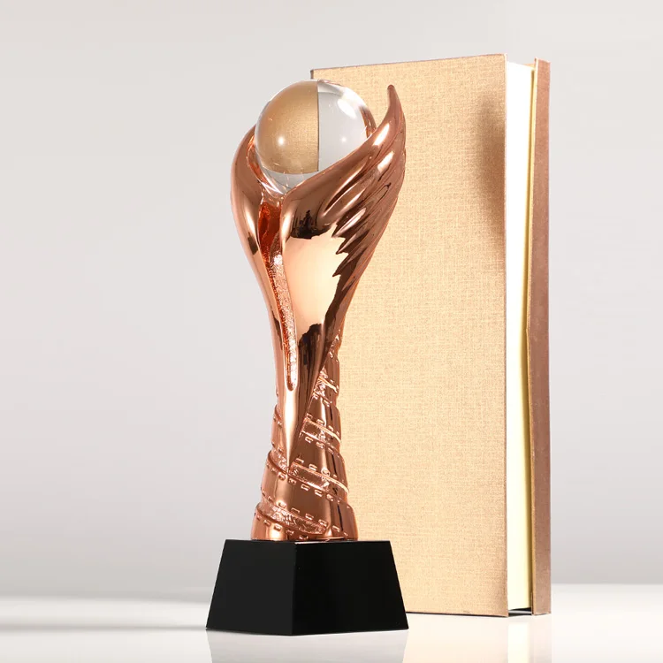 Gold, silver and copper resin trophy customized football and basketball competition group award making flying wings games