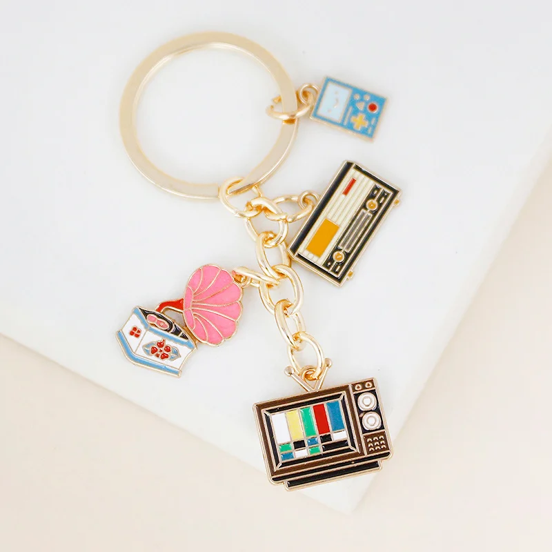 New stylish alloy keychain camera TV castle pot fried eggs Christmas tree bicycle pendant bag decorative car pendant gift