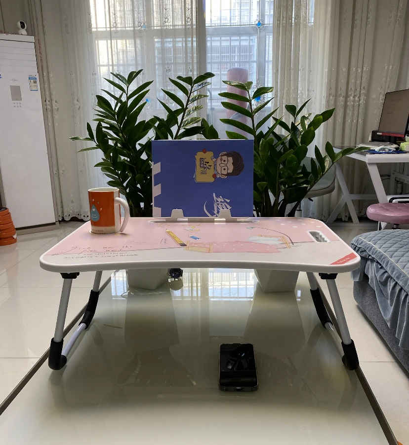 Portable and adjustable Mac laptop bed stand desk laptop desk suitable for home work travel and comes with a cup holder