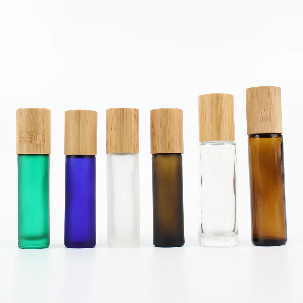 Wholesale bamboo lid glass amber frosted clear green blue bottle with roller