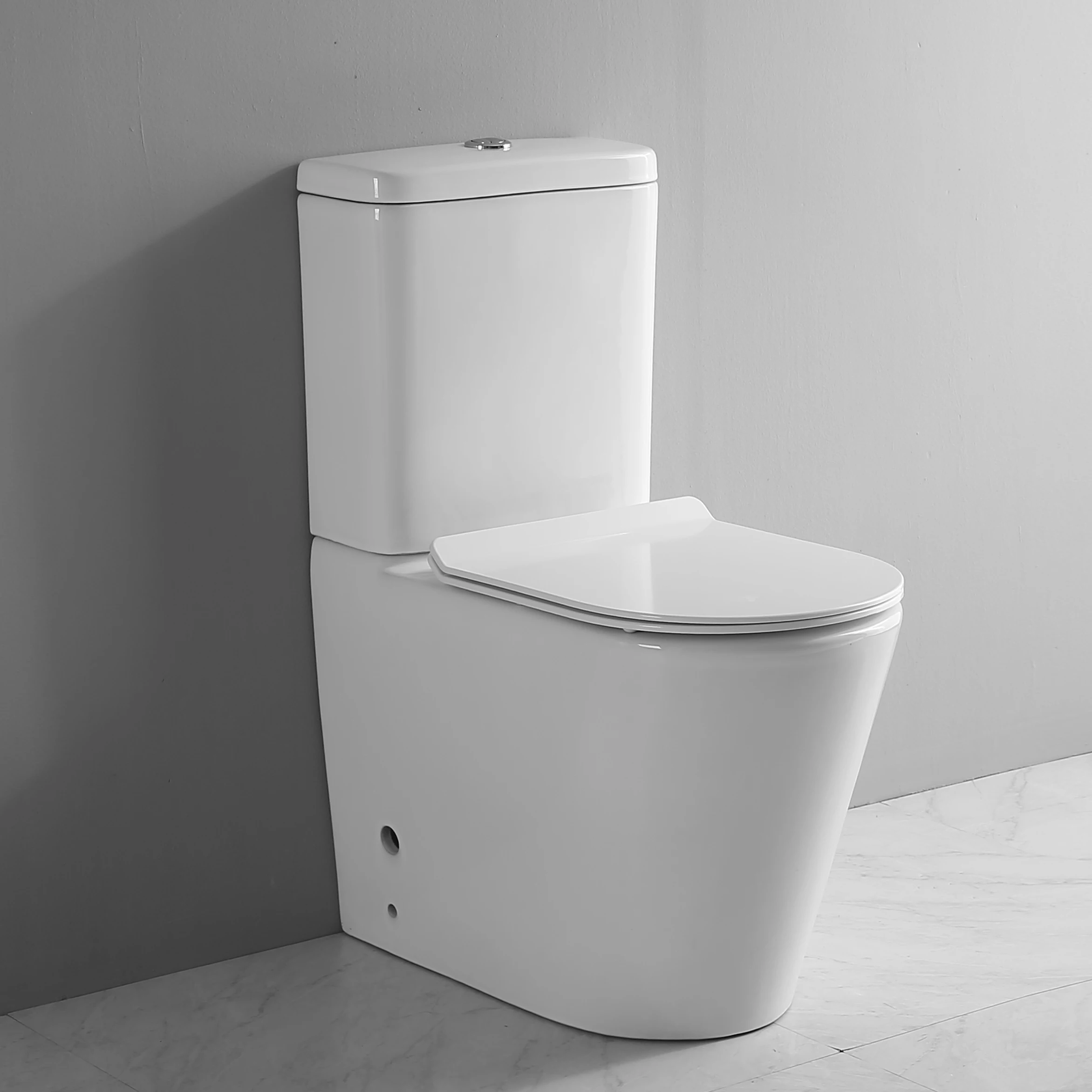 Hotel Style White Color Comfort Height Floor Mounted Rimless P-trap Dual Flush Back To Wall Ceramic Bathroom Wc Toilets