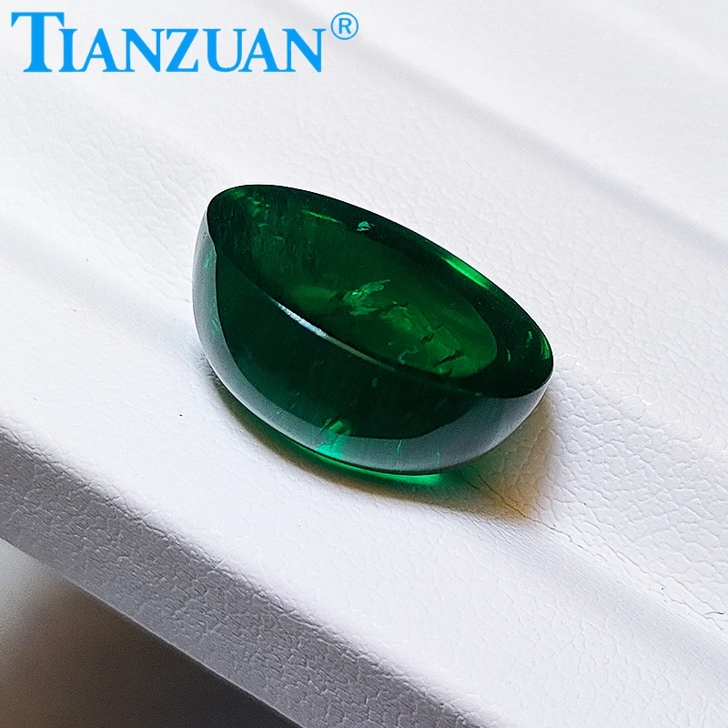 Oval shape flat back cabochon Hydrothermal emerald green color including minor cracks inclusions loose gem stone