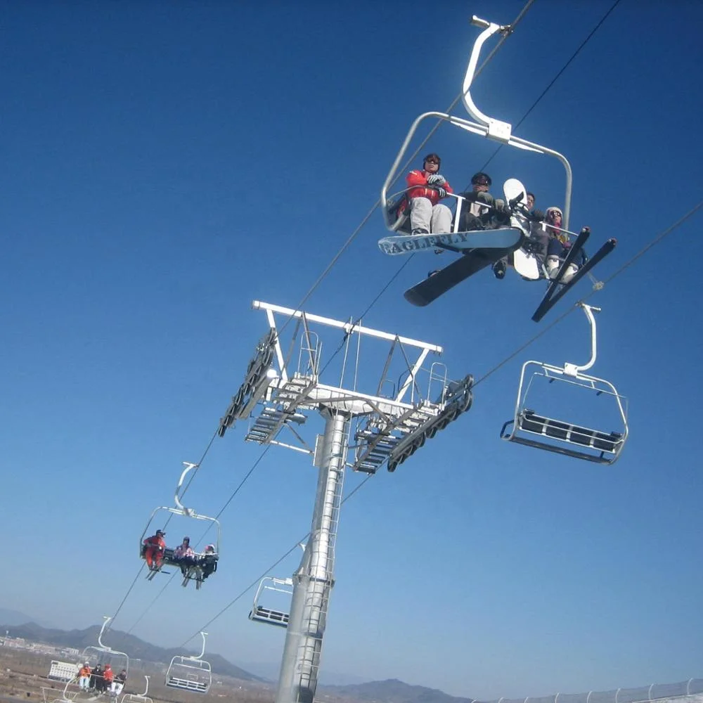 Ropeway chairlift with  four seats for four persons one chair  in ski resort ski area