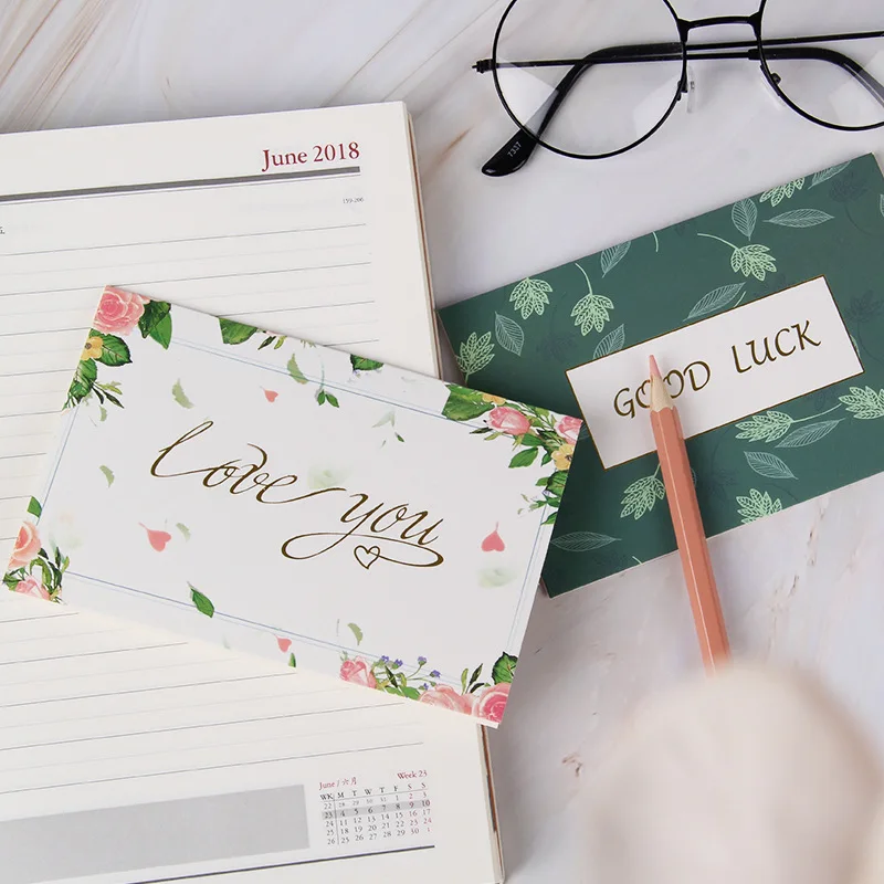 Customized flower thank-you cards with wild flowers, accompanied by envelopes. Floral blank greeting cards